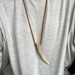 light brown leather necklace with bone horn